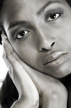 A beauty portrait taken from an african model in the studio resting on her hands