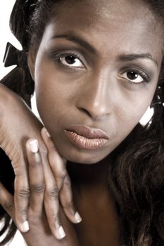 A beauty portrait taken from an african model in the studio paying attention