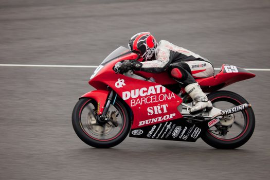 JEREZ DE LA FRONTERA, SPAIN - NOV 20: Javier Martinez pilot of motorcycling of 125cc in the Spanish championship of velocity (CEV) on Nov 20, 2010, in racetrack of velocity of Jerez de la Frontera