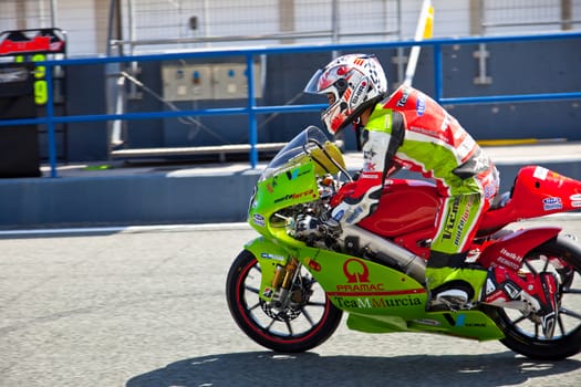 JEREZ DE LA FRONTERA, SPAIN - APR 17: Juanfran Guevara pilots his 125CC motorcycle at the start of the CEV Championship on April 17, 2011 in Jerez de la Frontera, Spain.
