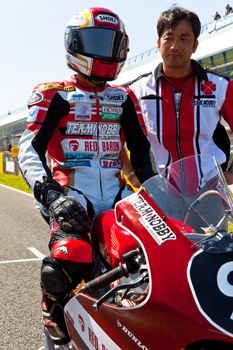 JEREZ DE LA FRONTERA, SPAIN - APR 17: 125cc motorcyclist Mori Syunya waiting on the starting gates in the CEV Championship race on April 17, 2011 in Jerez de la Frontera, Spain.