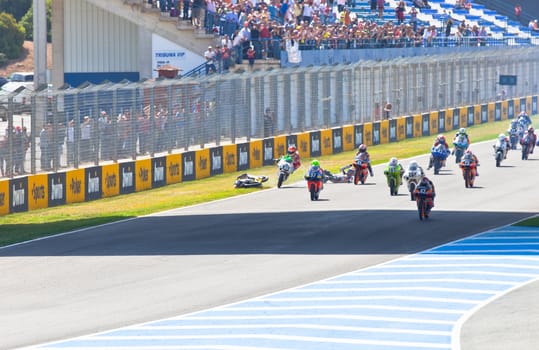 JEREZ DE LA FRONTERA, SPAIN - APR 17: Motorbike competitors begin the uneven 125cc race in the CEV Championship on April 17, 2011 in Jerez de la Frontera, Spain.