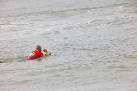 SAN FERNANDO, CADIZ, SPAIN - FEB 19: Unknown bodyboader taking waves on the 2nd championship of Surf and BodyBoard Impoxibol on Feb 19,2011 on the beach of Camposoto of San Fernando, Cadiz, Spain