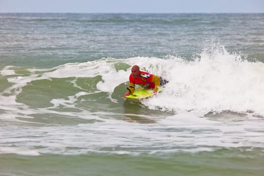 SAN FERNANDO, CADIZ, SPAIN - FEB 19: Unknown bodyboader taking waves on the 2nd championship of Surf and BodyBoard Impoxibol on Feb 19,2011 on the beach of Camposoto of San Fernando, Cadiz, Spain