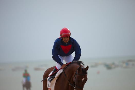 SANLUCAR DE BARRAMEDA, CADIZ, SPAIN - AUGUST 07: Unknown rider at the start of the horses races of the beach of Sanlucar de Barrameda on August 07, 2010 in Sanlucar de Barrameda, Cadiz, Spain.