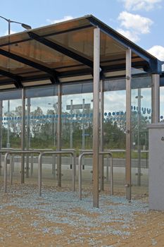 Bus stop vandalised by smashing the glass windows.