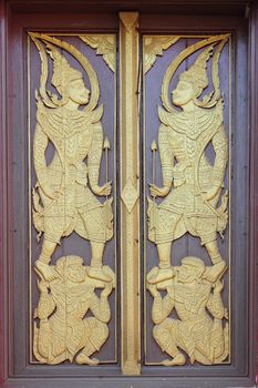 Delicate and elaborated detailed of the Buddhist monastery window, Laos