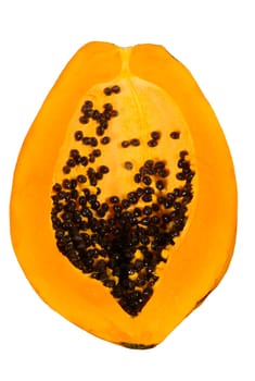 Half of a papaya fruit with seeds and fruitstand.