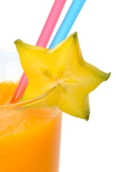 Papaya juice with carambola on the glass and two straws