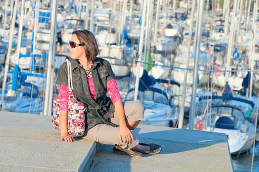 Closeup Portrait of beautifull womanin the background of yachts