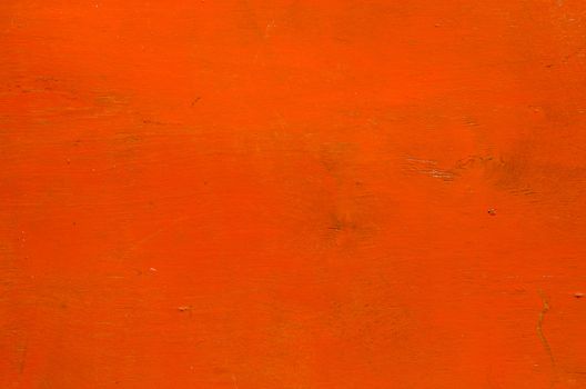 Wooden plank orange color paint background.