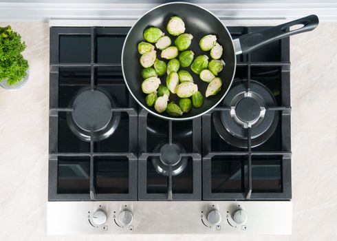 vegetables dish prepared in a black skillet in the kitchen