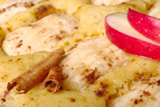 Cinnamon sticks on applecake with apple slices