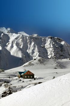 Winter holiday house in russian mountains. Elbrus