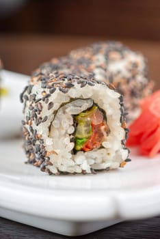 Closeup of Sushi rolls at plate with sesame