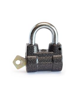 Key inserted into padlock on white background. Isolated with clipping path