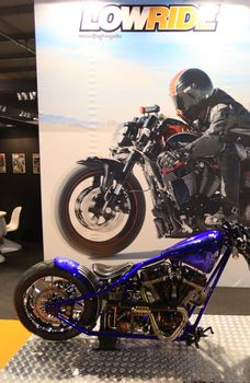 Looking at new motorcycles stands at EICMA, International Motorcycle Exhibition 2010 in Milan, Italy.