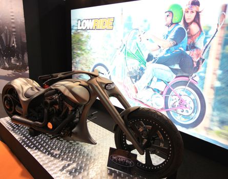 Looking at new motorcycles stands at EICMA, International Motorcycle Exhibition 2010 in Milan, Italy.