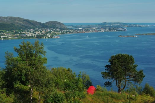 Camping above Aalesund, Norway with a view on the surrounding skerry landscape