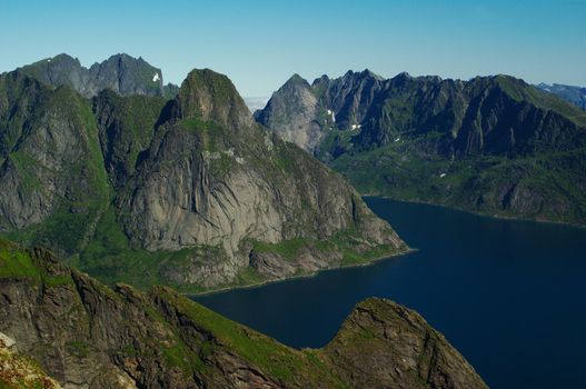 Fjordlandscape on the island Moskenesoya, Lofoten in Norway. On the left is the entry to Kjerkfjorden.  