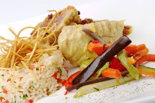 Main dish: Fried vegetables with rice and fish in the background (Selective Focus)