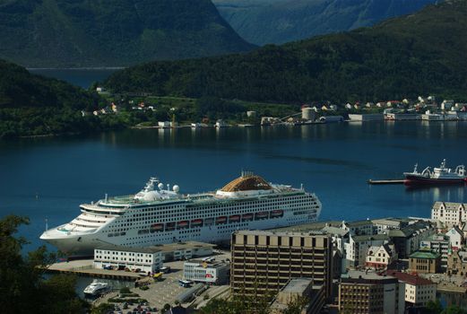 AALESUND, NORWAY - JULY 2: The Oceana, a big cruise ship on July 2, 2008 in the harbour of Aalesund, Norway. The Oceana is categorized as a mid-sized family-friendly ship by the owner P&O Cruises.