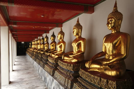 Buddha statues at the temple at Bangkok, Thailand.