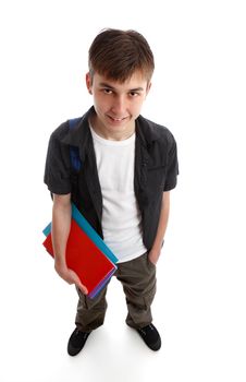 A male teenage student standing in casual clothes and holding some books in one hand.  White background.