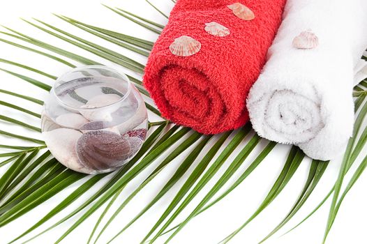 Bath towels and spa products with palm branch