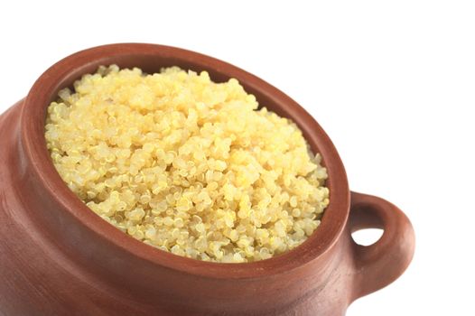 Cooked white quinoa in rustic bowl which can be eaten as a side dish like rice and is rich in proteins isolated on white (Selective Focus, Focus on the front of the quinoa) 