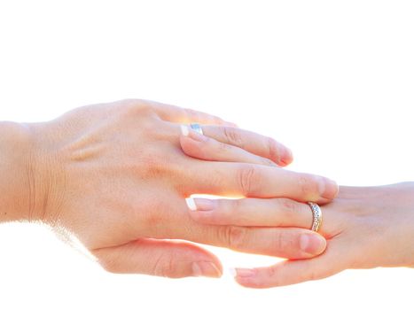 Married couple holding hands towards clear white background