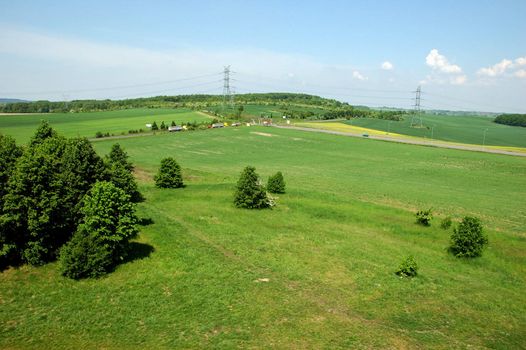 Silesia landscape near Tarnowskie Gory town, Poland. Natural meadows and hills covered with green grass and trees. 