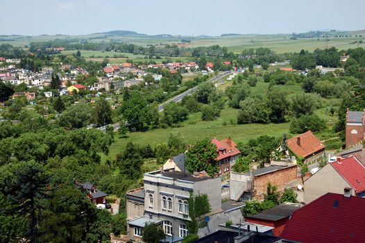 General landscape of Zabkowice Slaskie (previous name Frankenstein) in Lower Silesia, Poland. City buildings and hills viewed from town tower.