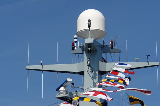 Close details of radar  system and communication tower on a navy patrol frigate