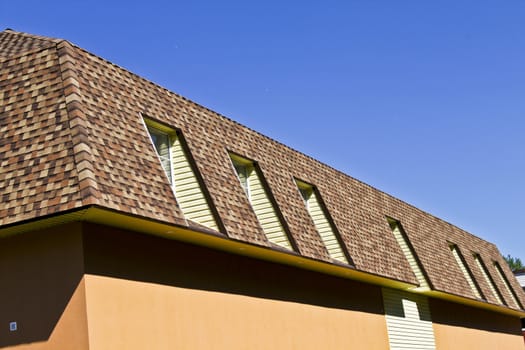 newly built, modern, American-style house with a tiled roof