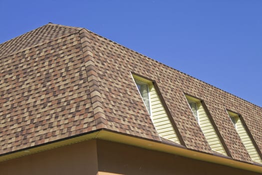 newly built, modern, American-style house with a tiled roof