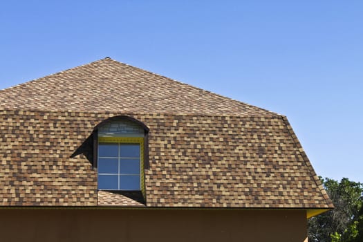 newly built, modern, American-style house with a tiled roof