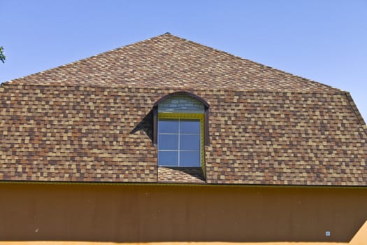 newly built, modern, American-style house with a tiled roof