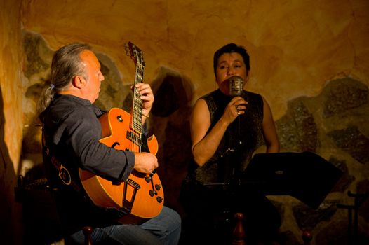 Classic jazz duet performing with stage lighting