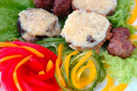 Stuffed aubergine with meat, cheese, sesame  and different vegetables.