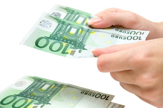 Woman stacking Euro bills. Isolated on a white background.