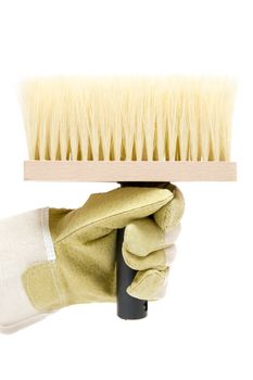 Gloved hand holding a paint brush. Isolated on a white background.