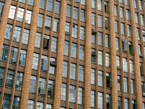 The windows of an old urban office building.
