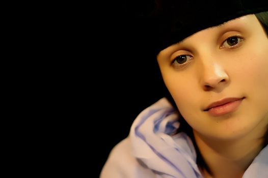 brunette young woman close portrait in black background