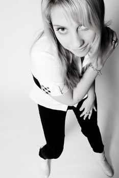 Studio portrait of a long blond girl seen from a high perspective