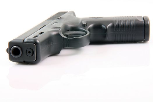 semiautomatic handgun isolated on white background with small reflection