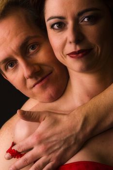 Married lovers portraits taken in the photo studio undressing