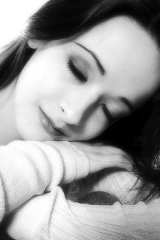 Studio portrait of pretty brunette sleeping