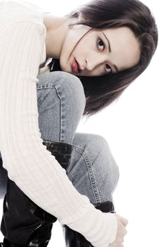 Studio portrait of pretty brunette looking pensive