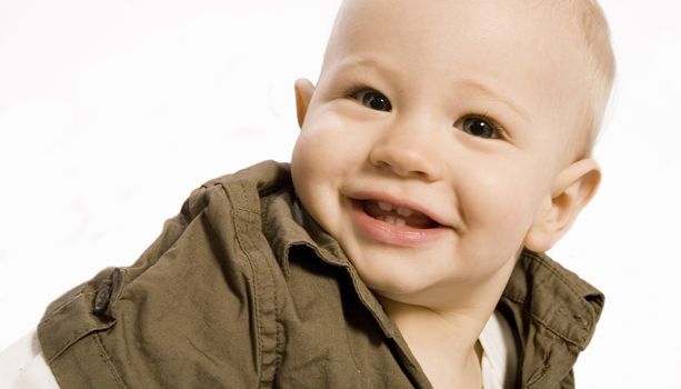 Studio portrait of baby boy laughing